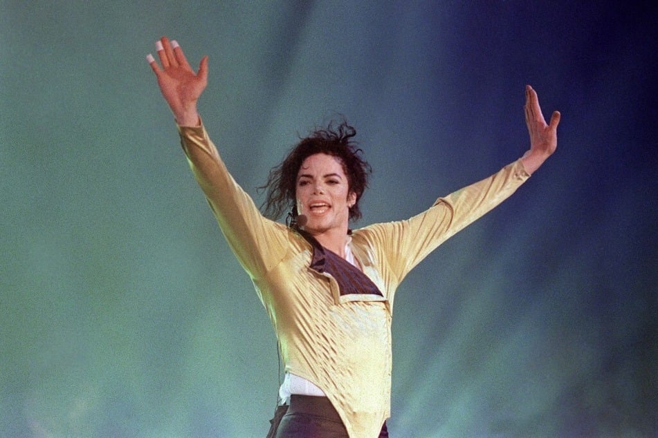 Michael Jackson performs before an estimated audience of 60,000 in Brunei on July 16, 1996.