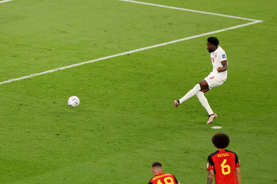 Alphonso Davies sees his penalty saved by Belgium goalkeeper Thibaut Courtois.