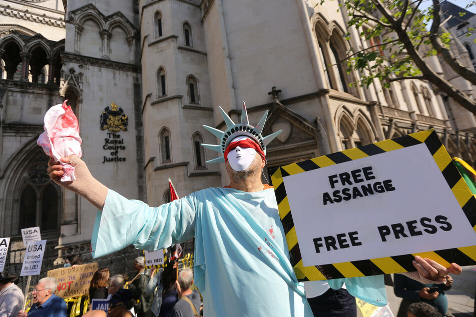 Julian Assange supporters gathered outside the Royal Courts of Justice as they waited for the decision on the US government's appeal for extradition.