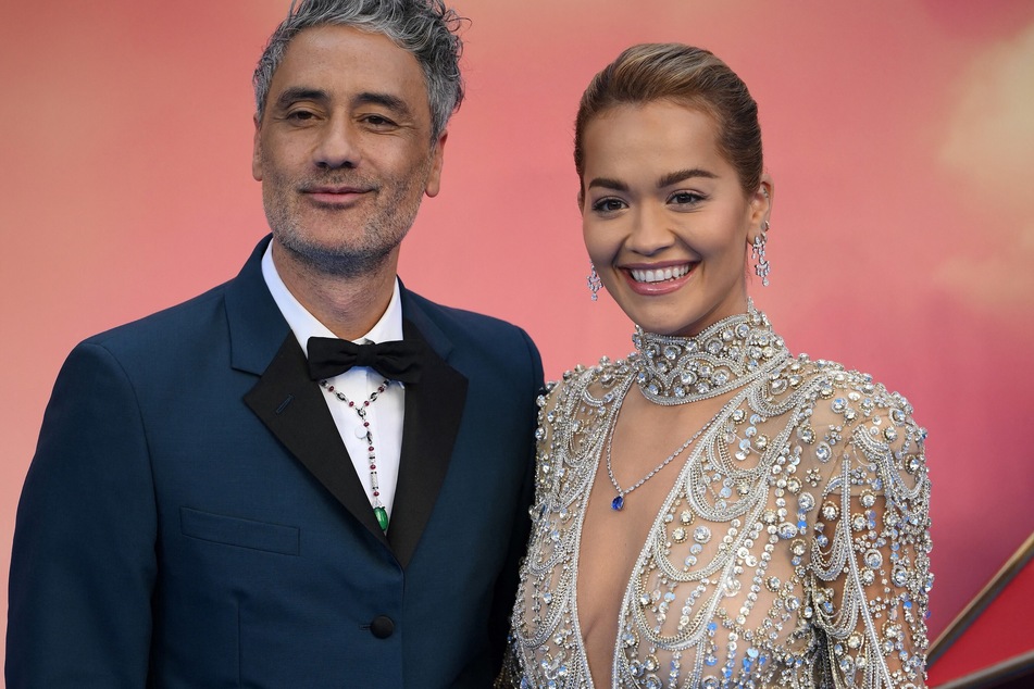While giving a tour of her home in London, British singer Rita Ora (r) might have just confirmed she's married to Taika Waititi.