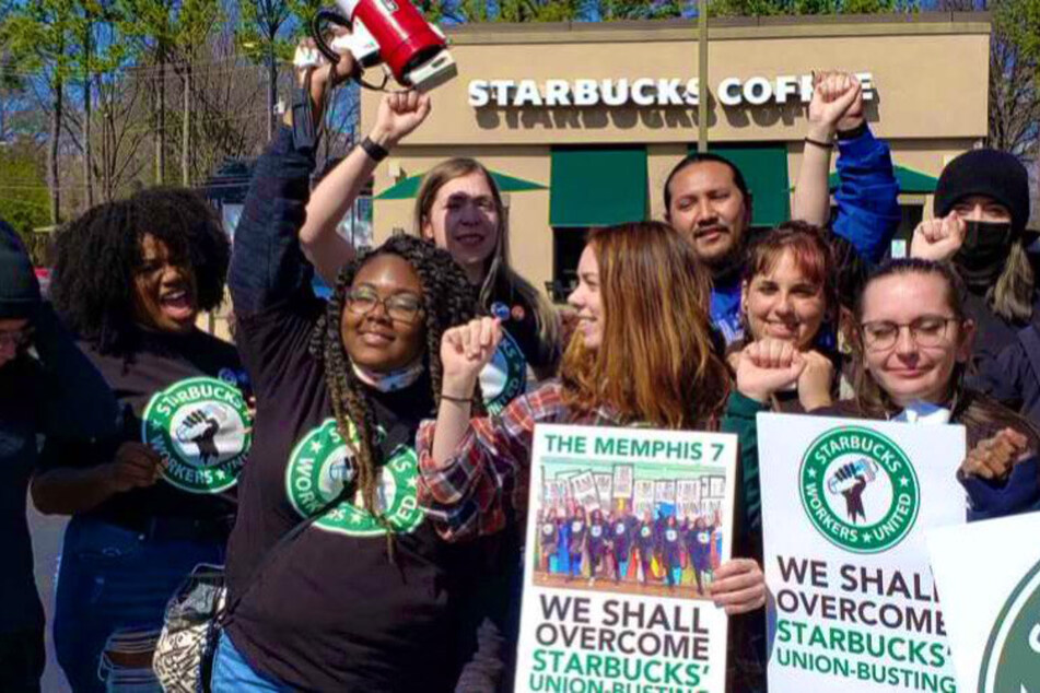 Members of the Memphis Seven and their supporters rally against Starbucks' union busting outside the Poplar and Highland store.