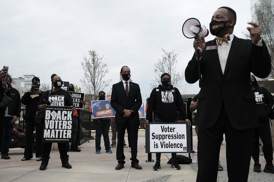 Demonstrators in Atlanta met to protest the restrictive voting law that disproportionately disadvantages people of color.