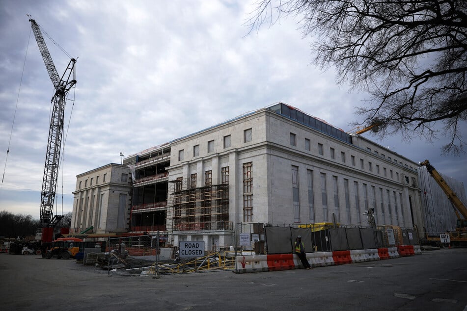 Workers are seen at the Federal Reserve renovation site on January 14, 2026, in Washington, DC.
