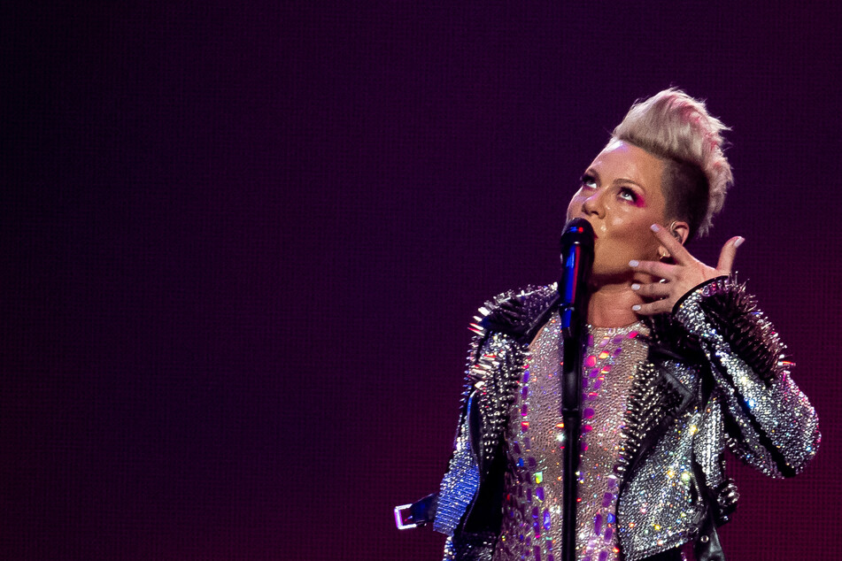 A concertgoer in London threw her mother's ashes on stage during a Pink concert last Sunday.