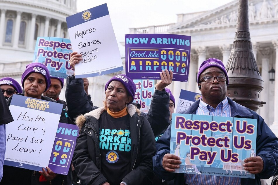 Airport workers rally on Capitol Hill to demand that Congress pass the Good Jobs for Good Airports Act.