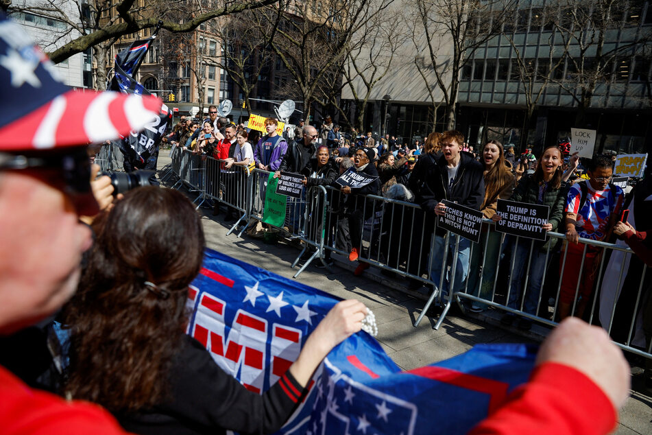 Pro- and anti-Trump protesters face off outside the Manhattan Criminal Courthouse ahead of the ex-president's arraignment.