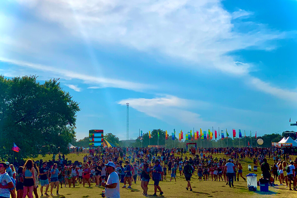 Festival goers meander across Zilker Park at Austin City Limits Music Festival in October 2019.