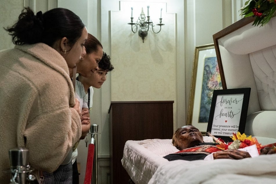 Visitors look at the body of Stoneman Willie ahead of his burial in Reading, Pennsylvania.