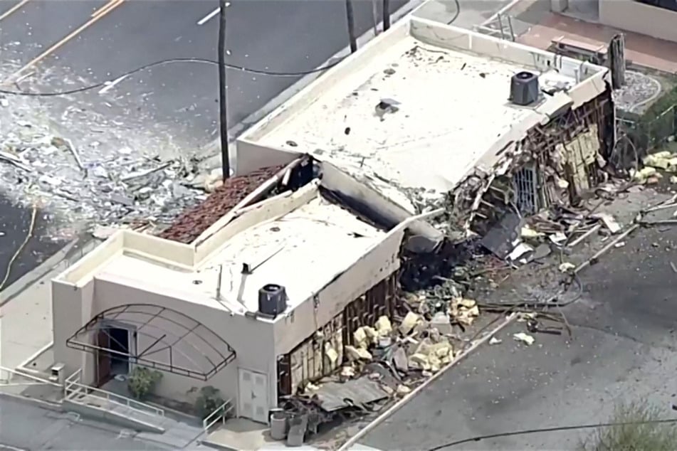 Debris is spilled onto the street after a bomb exploded near a reproductive health facility in Palm Springs, California, on May 17, 2025.