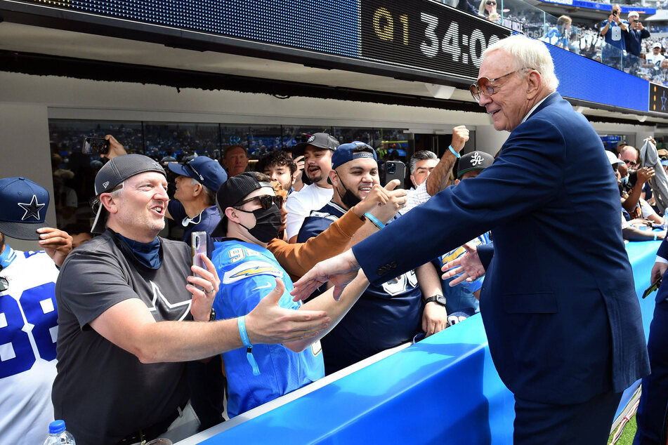 Cowboys owner and general manager Jerry Jones greets fans during a game in 2021.