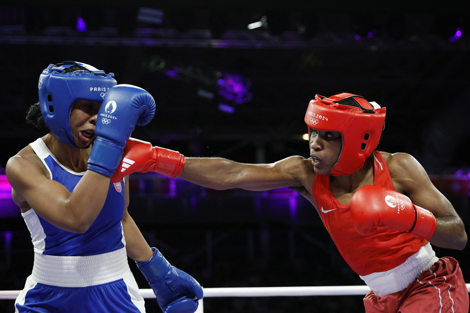 Cindy Winner Djankeu Ngamba of the Refugee Olympic Team in action against Davina Michel of France.