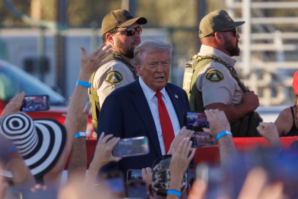 Riverside Country officers stand guard as Republican presidential nominee Donald Trump arrives at his rally in Coachella, California, on October 12, 2024.