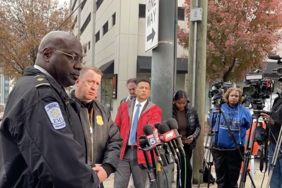 City of Atlanta Police Department chief Darin Schierbaum (2nd from. l.) said a protester had set themself on fire outside the Israeli consulate in Atlanta.