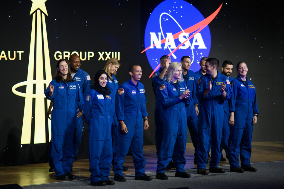 Candidates for NASA's Artemis lunar mission, which is set to take off in 2026, celebrate graduating in March 2024.