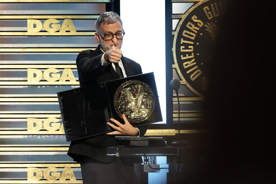 Paul Thomas Anderson accepts the Outstanding Directorial Achievement in Theatrical Feature Film honor for One Battle After Another during the 78th Annual Directors Guild of America Awards on February 7, 2026.