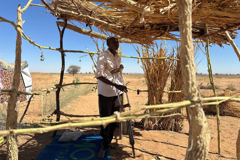 Ibrahim Noureldin leans on crutches at a makeshift shelter in the town of Tawila, in war-torn Sudan's western Darfur region, on March 2, 2026.