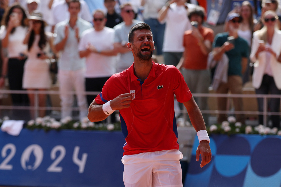 Novak Djokovic of Serbia reacts after winning gold against Carlos Alcaraz of Spain in the Paris Olympics men's singles final on Sunday.