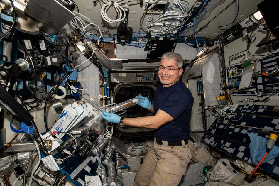 NASA astronaut and Expedition 66 Flight Engineer Mark Vande Hei was pictured conducting operations for the Plant Habitat-5 space agriculture experiment in January.