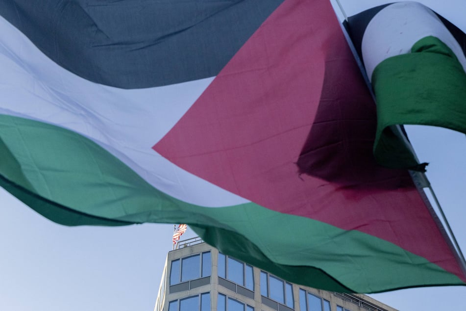 Palestinian flags wave during a protest near the White House in Washington DC on February 4, 2025.