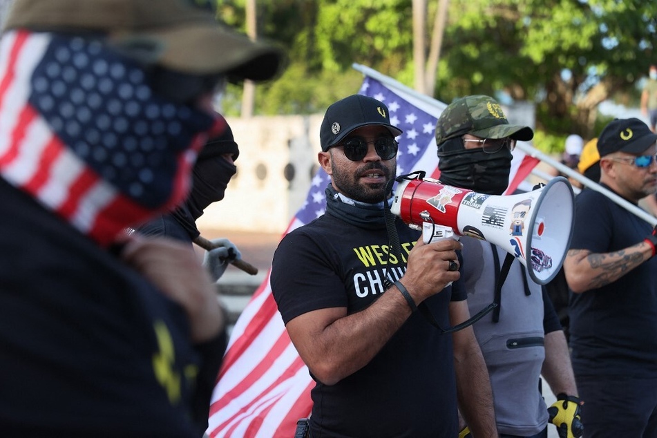 Enrique Tarrio uses a megaphone during a counter-protest at the Torch of Friendship to commemorate the one-year anniversary of the killing of George Floyd, on May 25, 2021, in Miami, Florida.