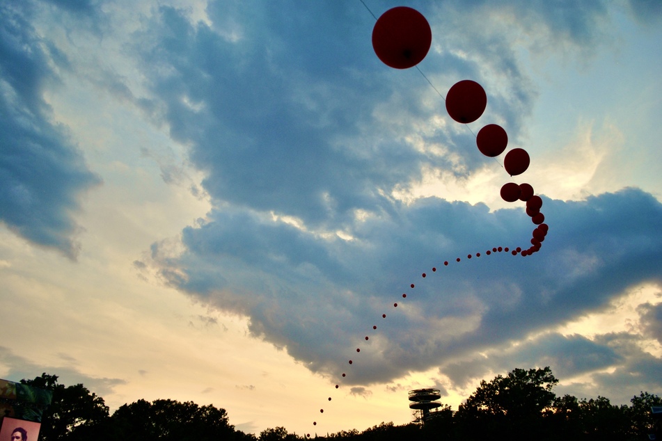 The Balloon Chain floats above the crowd at Governors Ball Music Festival on Saturday, June 10, 2023.