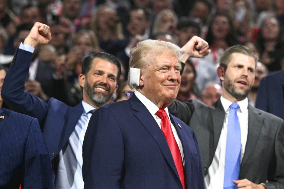 On Monday, President Donald Trump's (c.) sons unveiled a new family business venture that aims to rival America's biggest mobile phone companies.