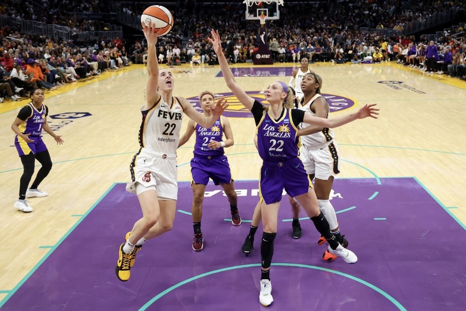 Caitlin Clark of the Indiana Fever shoots the ball against Cameron Brink of the Los Angeles Sparks at Crypto.com Arena.