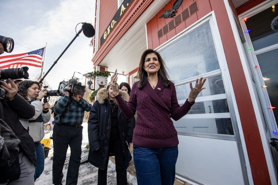 Former UN ambassador and 2024 Republican presidential hopeful Nikki Haley makes her way back to her car after speaking at Robie’s Country Store in Hooksett, New Hampshire, on January 18, 2024.