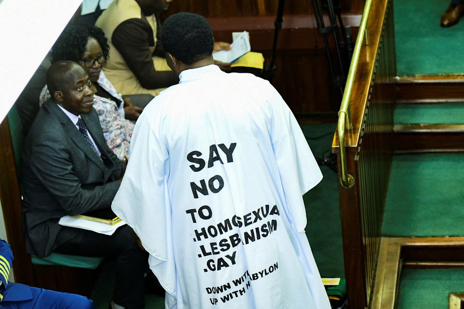 Members of Uganda's parliament shouted and displayed homophobic messages as they passed a draconian anti-LGBTQ+ bill.