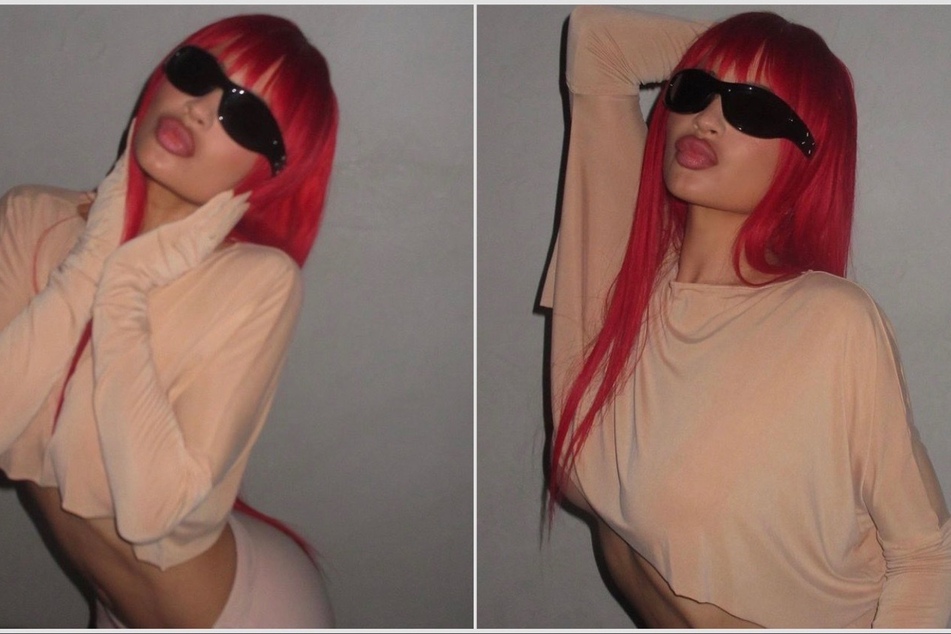 Kylie Jenner switched her up looks by sporting a fiery red mane and bold ensemble on Instagram.