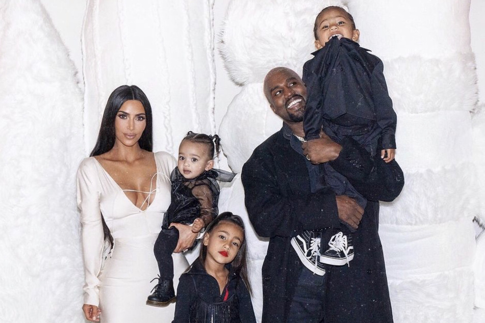 Happier times! Kim Kardashian and Kanye 'Ye' West pose in a family pic with three of their of their four children (from l. to r.): Chicago, North, and Saint West.