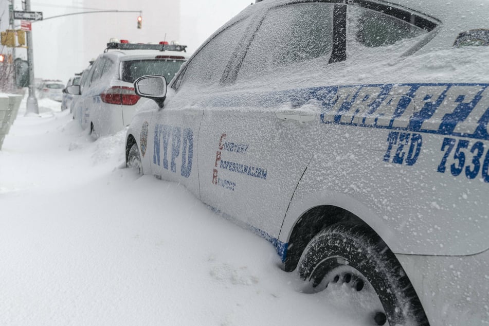 NYPD cars parked in Hudson Yards as major snow storm called nor'easter storm hit the region (stock image).