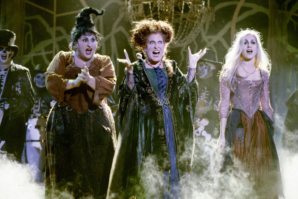 (From l to r:) Kathy Najimy, Bette Midler, and Sarah Jessica Parker will return as the pesky Sanderson sisters in the upcoming sequel Hocus Pocus 2.
