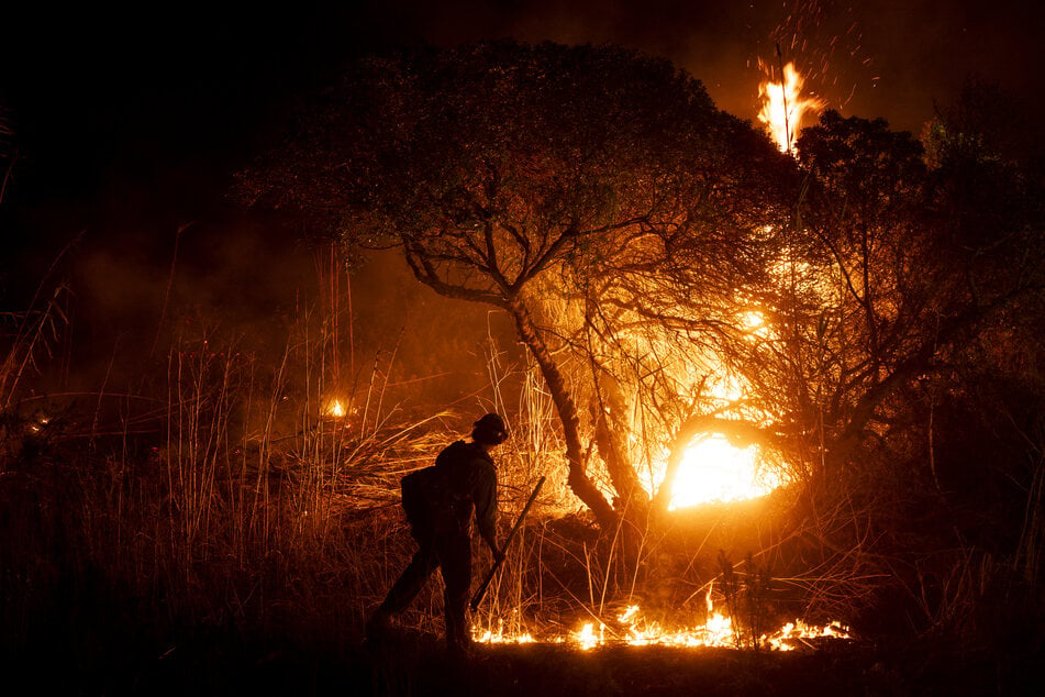 Los Angeles fires: Officials issue alerts as strong winds threaten to spark new blazes