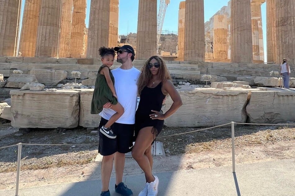 Serena Williams poses with her family in Athens, Greece during her offseason family vacation.