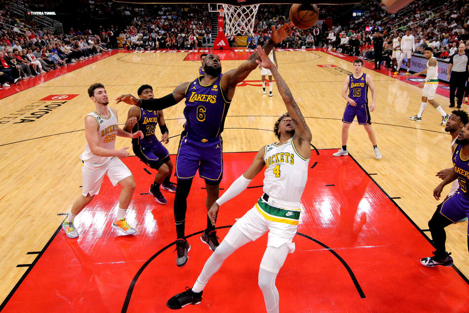 Los Angeles Lakers forward LeBron James blocks a shot by Houston Rockets guard Jalen Green during the third quarter at Toyota Center.