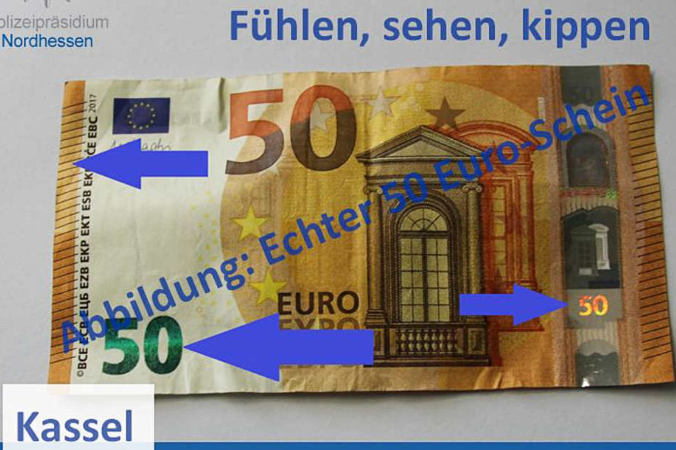Das Foto zeigt einen echten 50 Euro-Schein mit Hinweisen auf die Sicherheitsmerkmale.