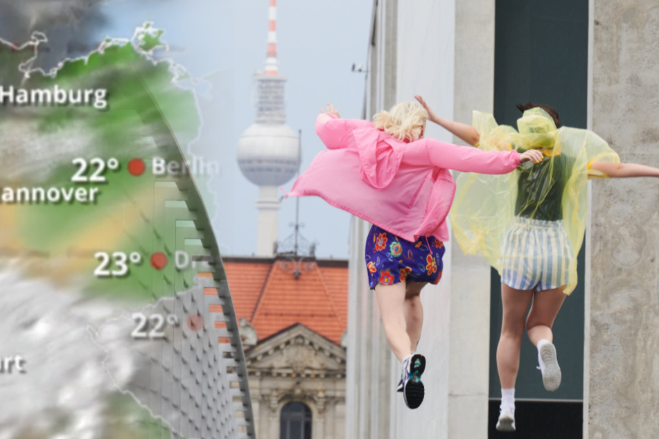 Zwei junge Frauen springen nach einem Regenguss mit bunten Regencapes über den Marie-Elisabeth-Steg am Paul-Löbe-Haus.