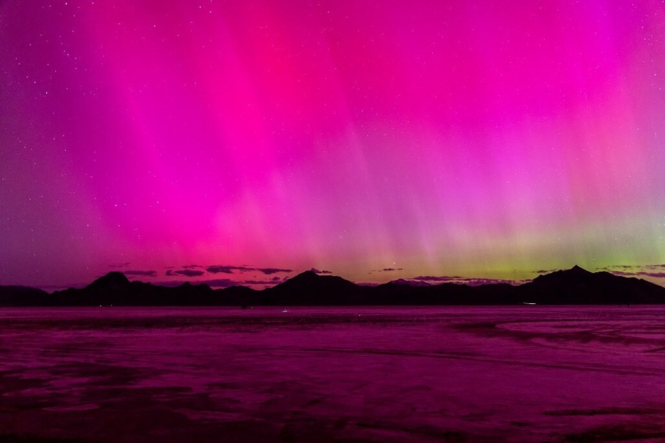 A geomagnetic storm lights up the night sky above the Bonneville Salt Flats in Wendover, Utah.