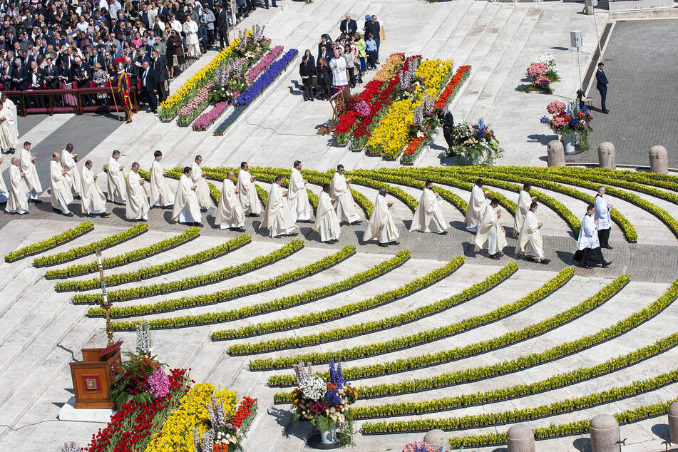St. Peter's Square was decorated with around 35,000 flowers and plants for the Easter Sunday celebration.