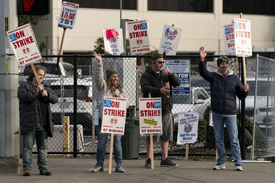 Boeing workers gather on a picket line near the entrance to a Boeing facility during an ongoing strike on October 24, 2024 in Seattle, Washington.