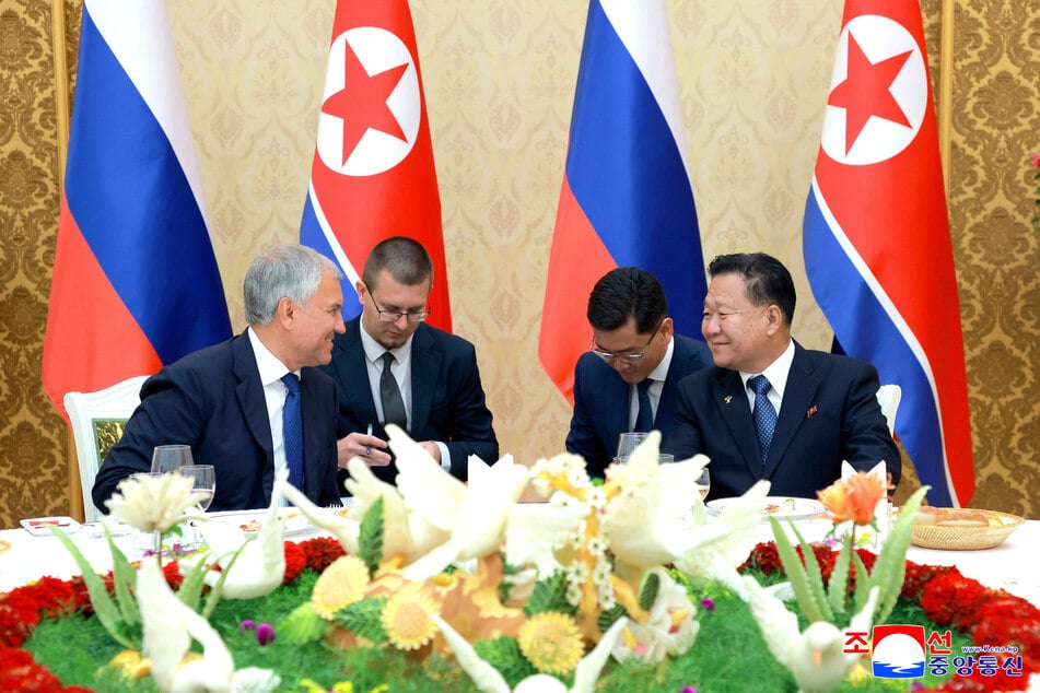 The chairman of the Russia's State Duma, Vyacheslav Volodin (l.), and Choe Ryong Hae (r.), standing committee chairman of the Supreme People's Assembly, chat at a welcome banquet at the Mansudae Assembly Hall in Pyongyang, North Korea, on August 14, 2025.