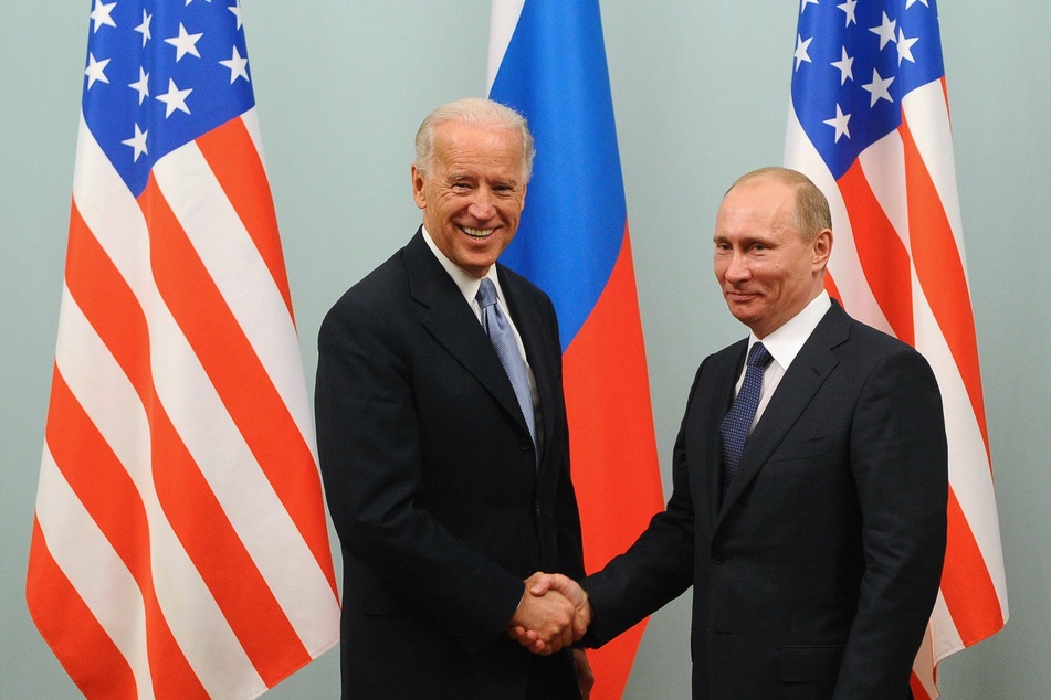Former vice president Joe Biden and Russia's prime Vladimir Putin shaking hands during a 2011 meeting. A decade later, the tone has changed.