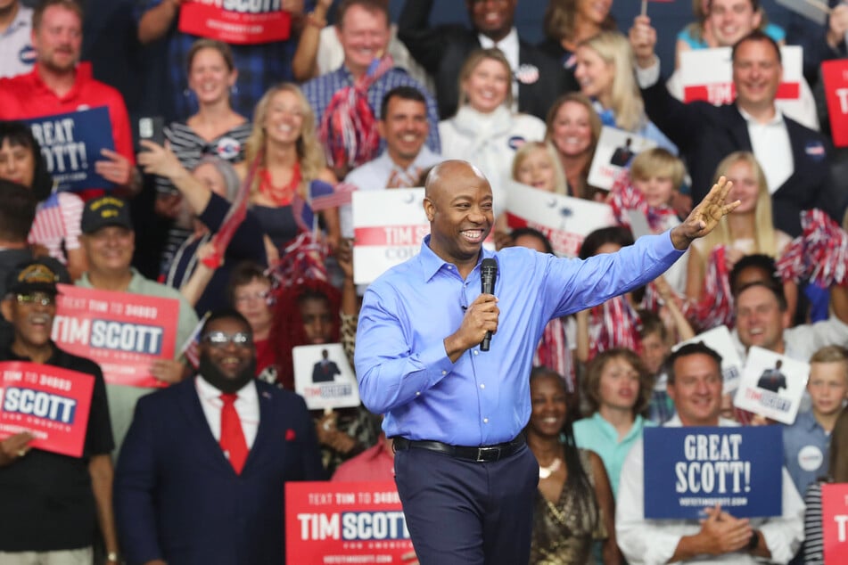 South Carolina Senator Tim Scott (c.) is running for president in 2024, but does he have any chance at taking on Donald Trump for the Republican nomination?