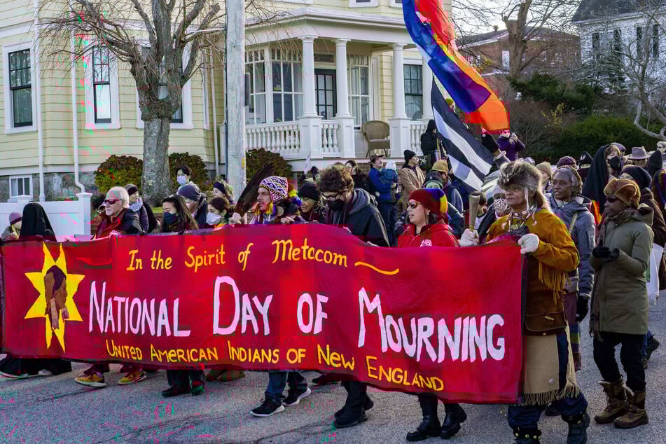 Indigenous people and allies march through Plymouth, Massachusetts, on the National Day of Mourning on November 27, 2025.