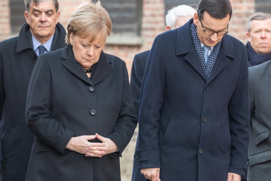 Bundeskanzlerin Merkel und Polens Ministerpräsident Morawiecki bei einer Gedenkveranstaltung in Auschwitz.