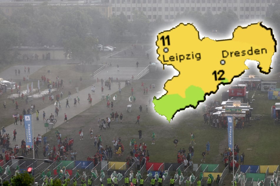Fußball-Fans in Leipzig suchen Schutz vor dem Regen. Auch das Achtelfinal-Spiel am Dienstag könnte nass werden.