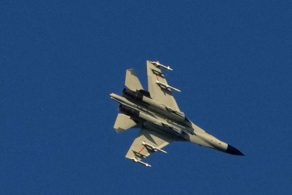 A People's Liberation Army fighter jet flying over Taiwan as part of Chinese military exercises.