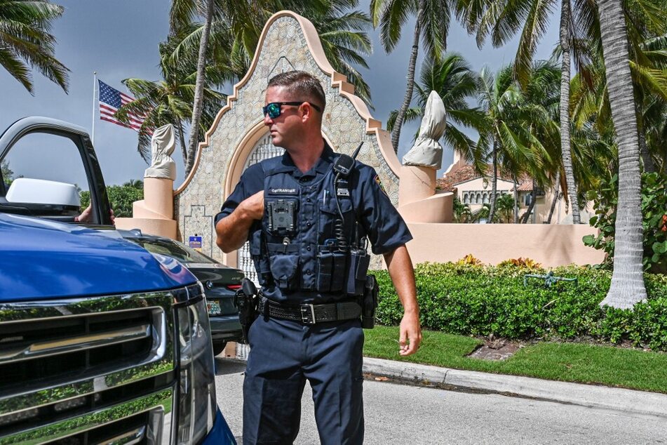 Local law enforcement officers are seen in front of the Mar-a-Lago home of former President Donald Trump.