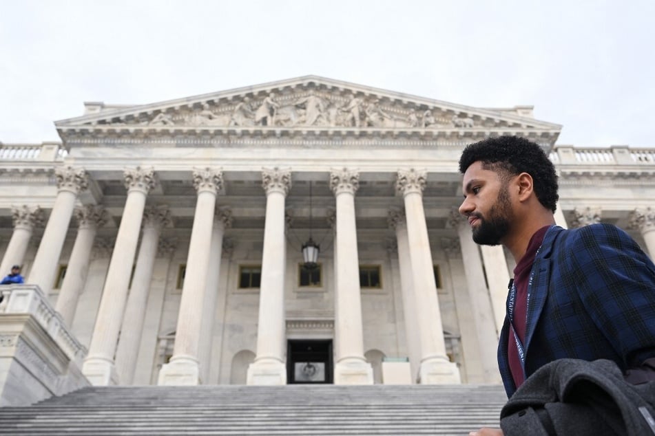 Representative-elect Maxwell Frost walks outside the US Capitol in Washington DC.